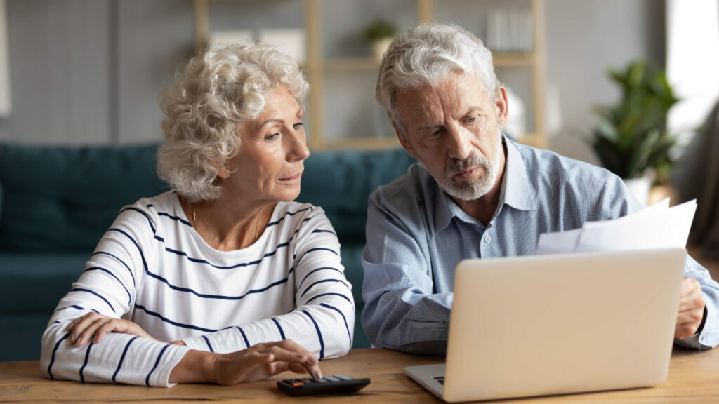 Learn How to Set a the Right Rent Price for Your Investment Property Investors discussing rent prices with Bethesda property managers