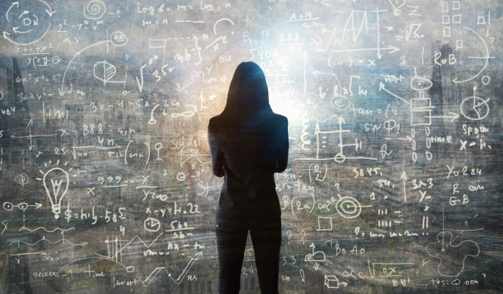Learn these important numbers and formulas for determining net income from your investment property. Woman stares at calculations to determine how to calculate her rental property's ROI.